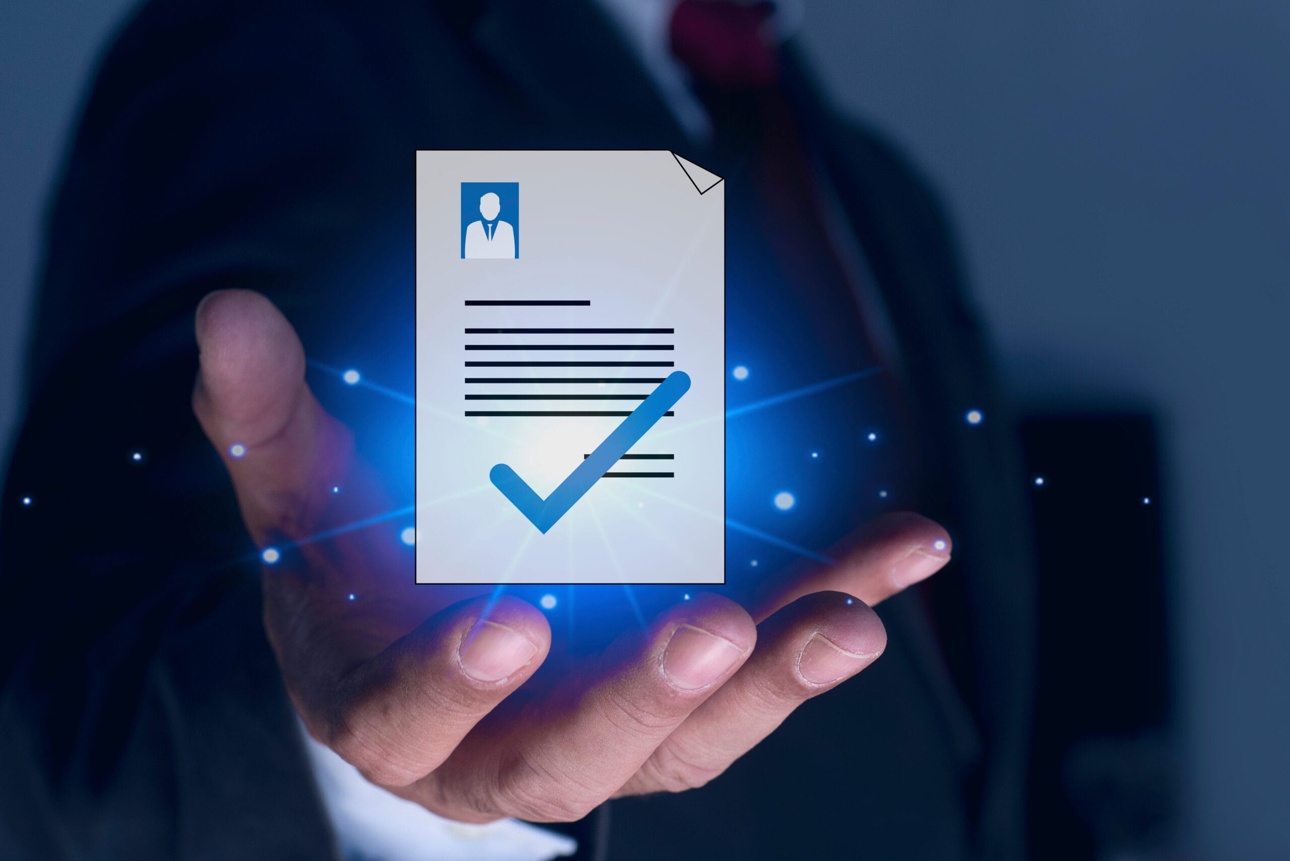 Businessman holding CV (curriculum vitae) resume document